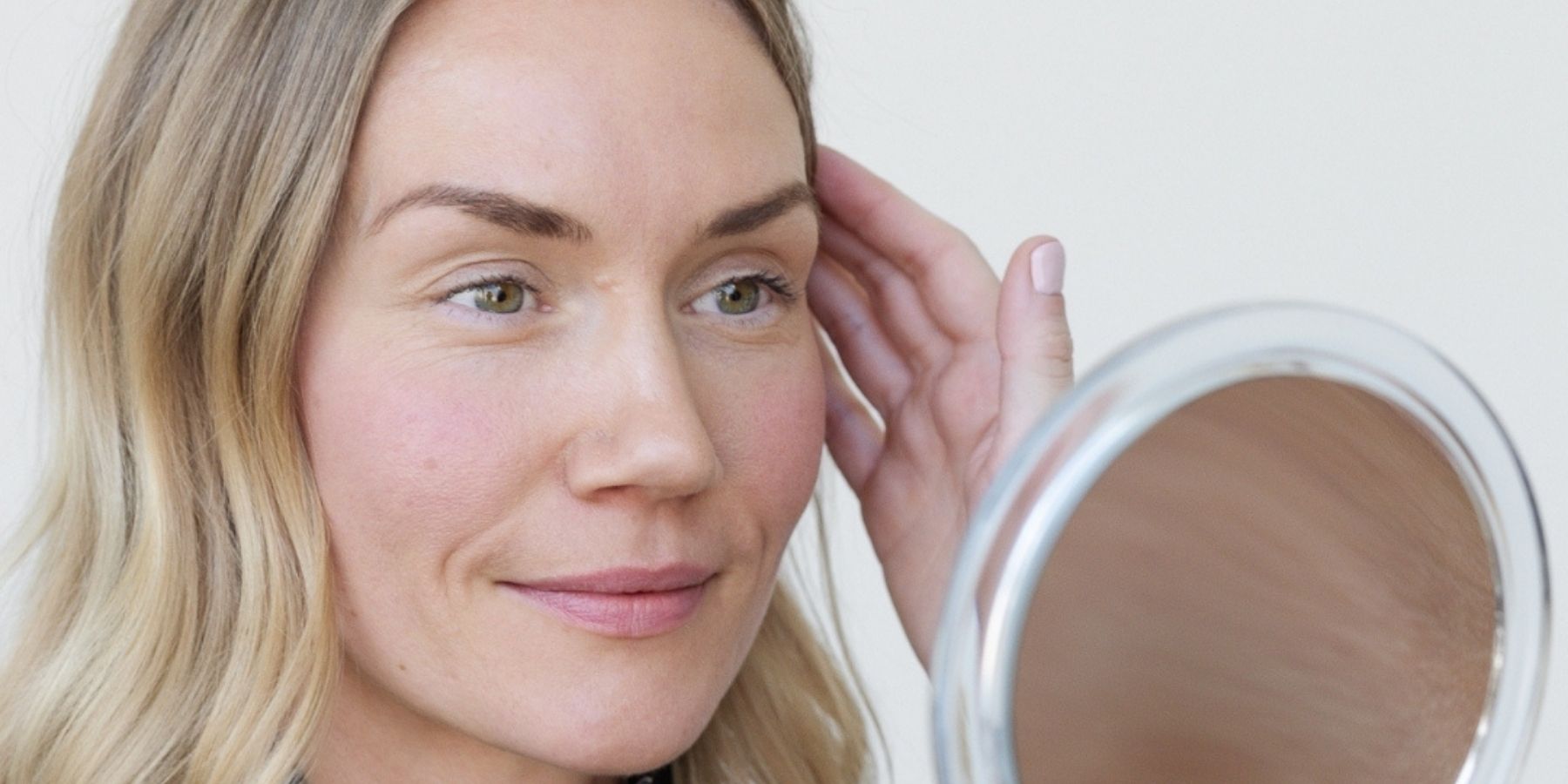 The patient looks in the mirror and wants to get rid of her forehead wrinkles